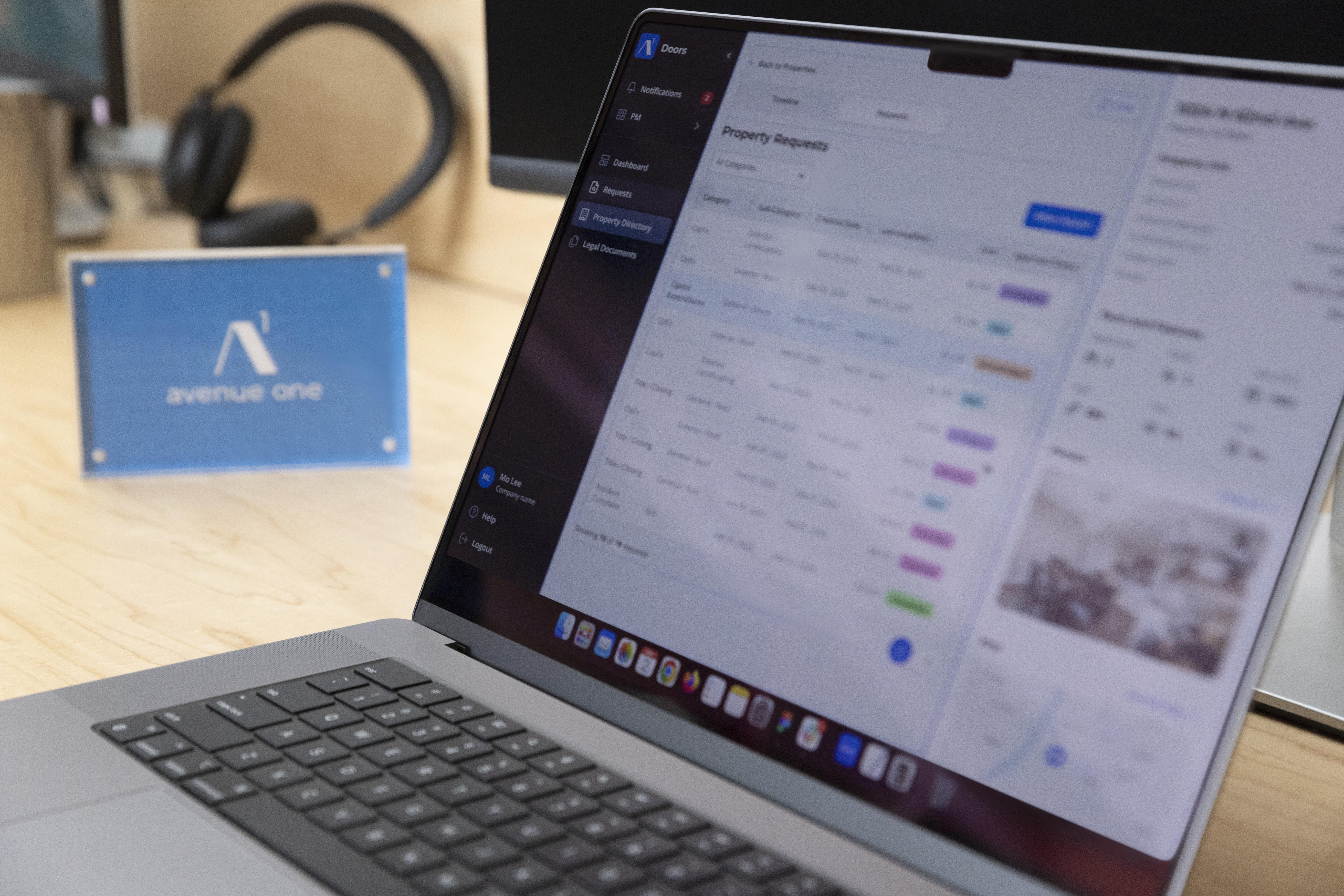 Photo of the side of a laptop with an avenue one platform on screen

