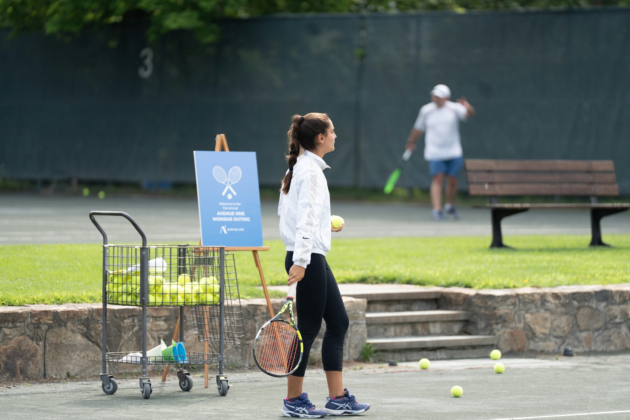 Woman playing tennis at a tennis court